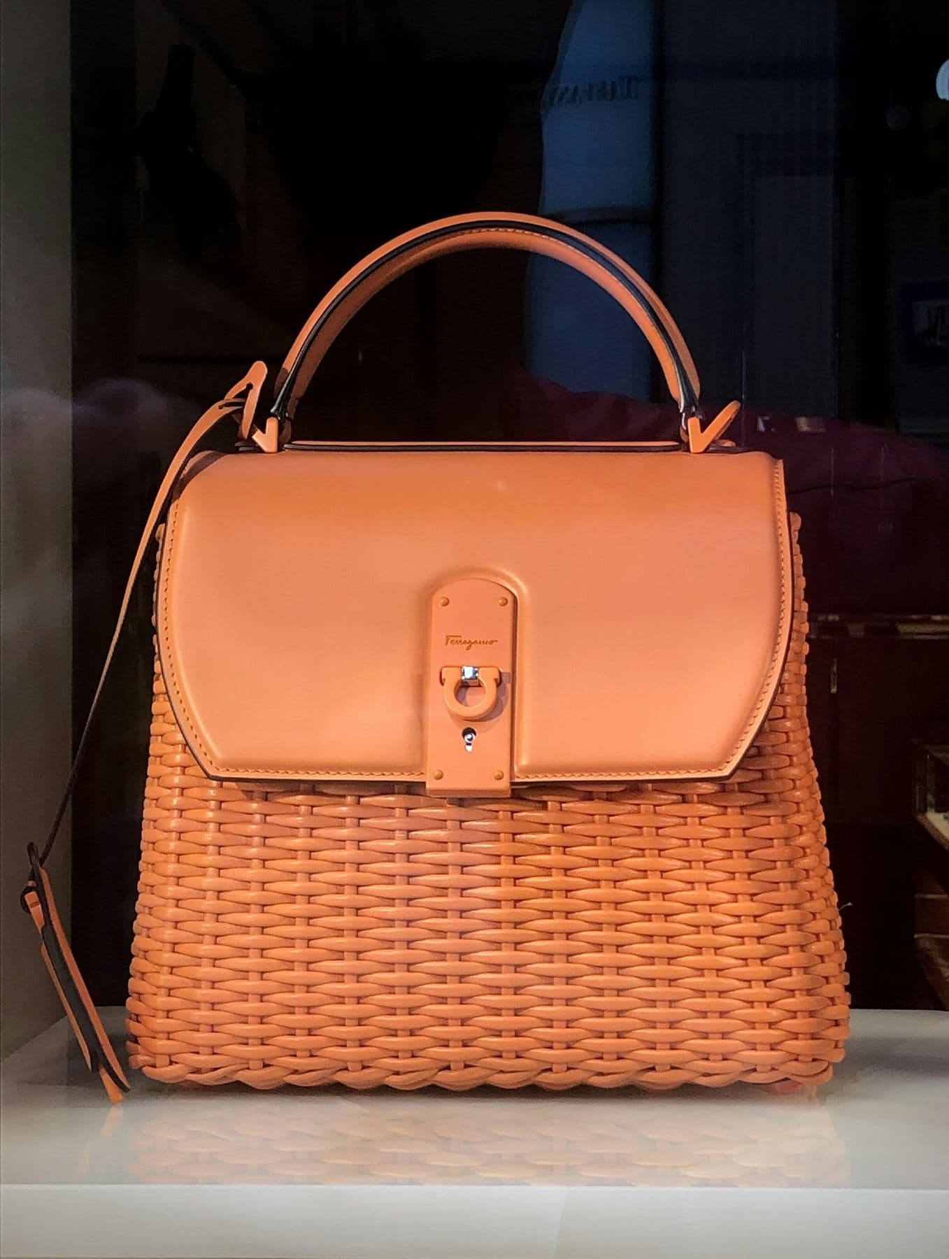 Orange wicker and leather top-handle bag